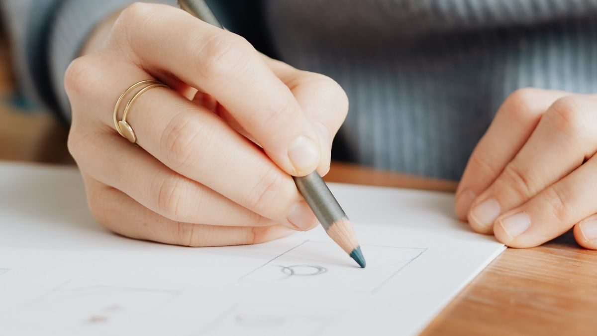 hands drawing featured image